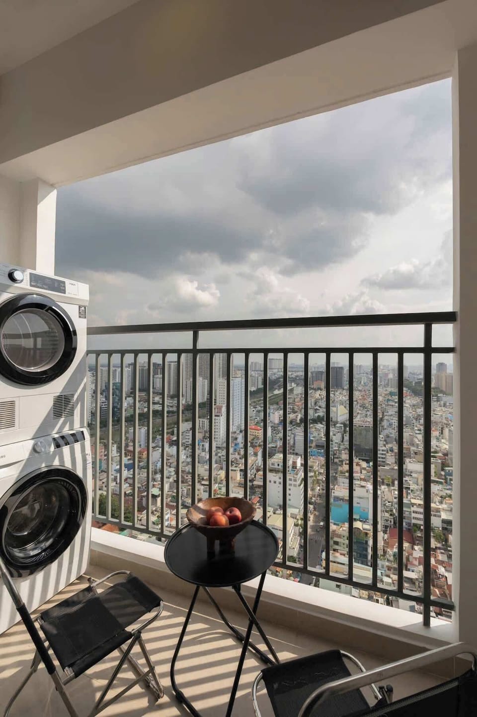 Enjoy a quiet moment or step out for a smoke on the private balcony overlooking the river and skyline. This space also includes a stacked washer, dryer and washing detergent for longer stays or fresh clothes anytime.