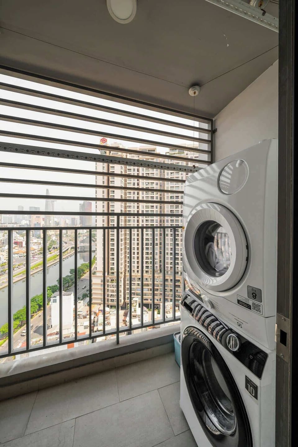 Balcony featuring a large washer machine and dryer use available for guest to use all at time for convenience.