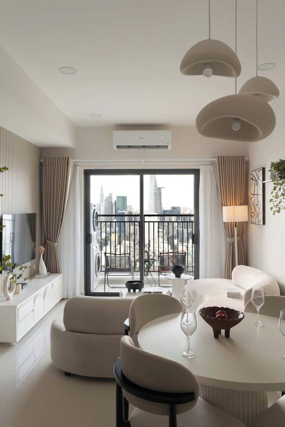 Bright lounge with balcony access. Enjoy natural light and city views. Please note: construction in front of the building partially blocks the view.