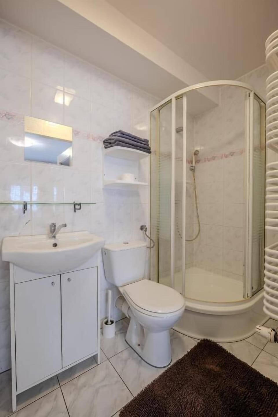 Shower, towels, soap, toilet paper