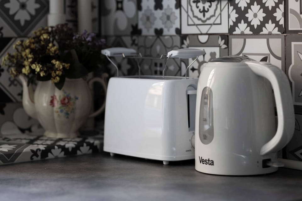 Close-up of the kettle and toaster available in the kitchen.