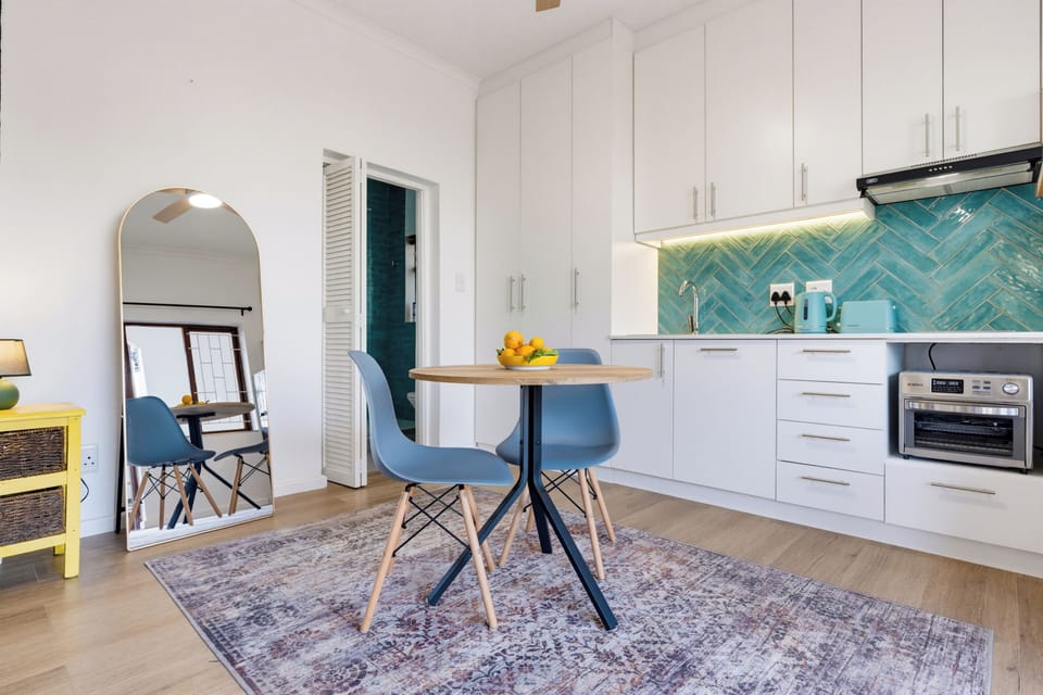 Bright modern kitchenette with stylish dining nook for two