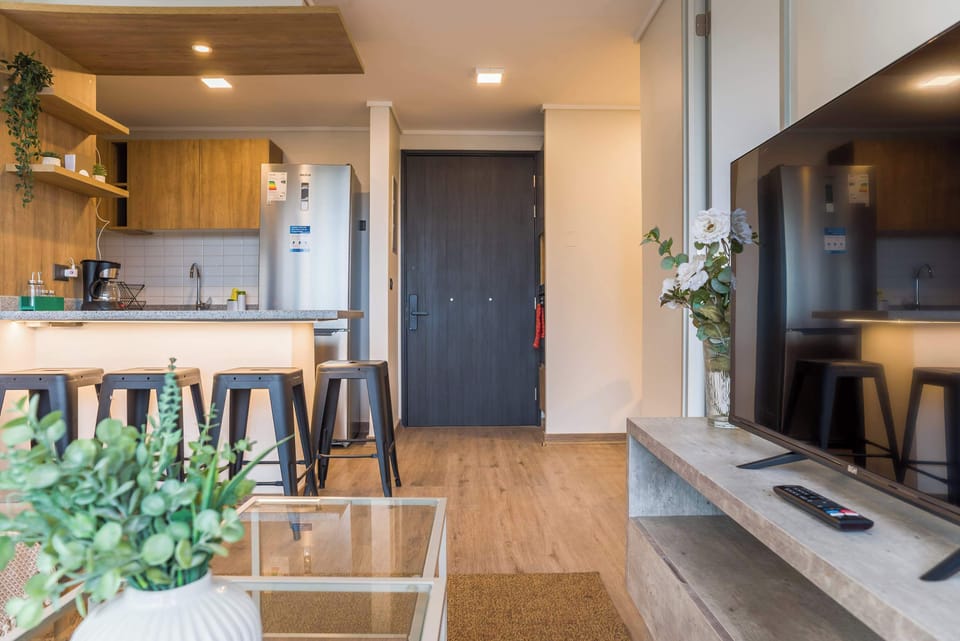 Stylish kitchen with bar seating and modern amenities, perfect for relaxing after a day of exploring.