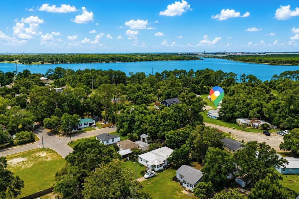 Settle into a leafy waterfront neighborhood with sparkling blue bay water just a short stroll away.
