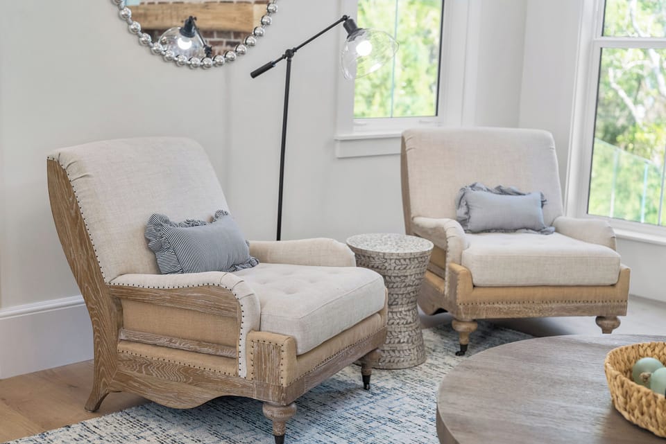 Settle into plush armchairs by sunlit windows and let the soft textures and natural light create your perfect reading nook or quiet retreat.
