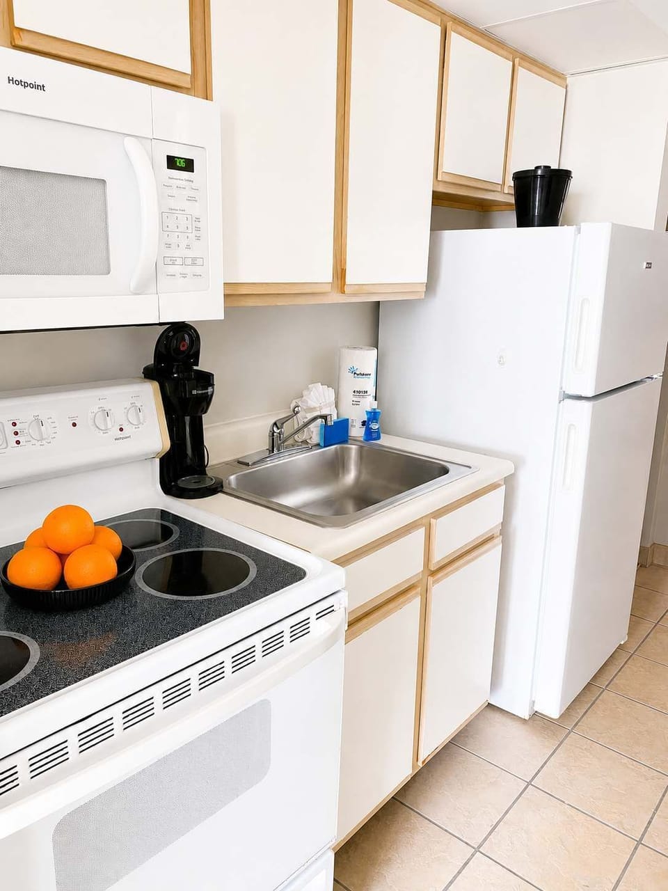 This fully equipped kitchen features a full-size refrigerator, stove, microwave, coffee maker, and all the essentials for preparing meals during your stay.