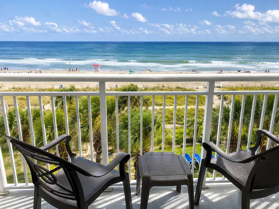 Take in breathtaking oceanfront views from your private balcony, complete with comfortable seating for enjoying your morning coffee or an unforgettable sunrise.