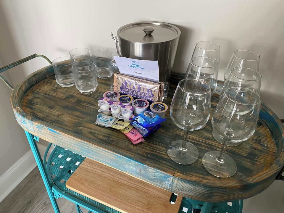 Enjoy a thoughtful welcome station complete with complimentary coffee, snacks, glassware, and an ice bucket—perfect for relaxing the moment you arrive.