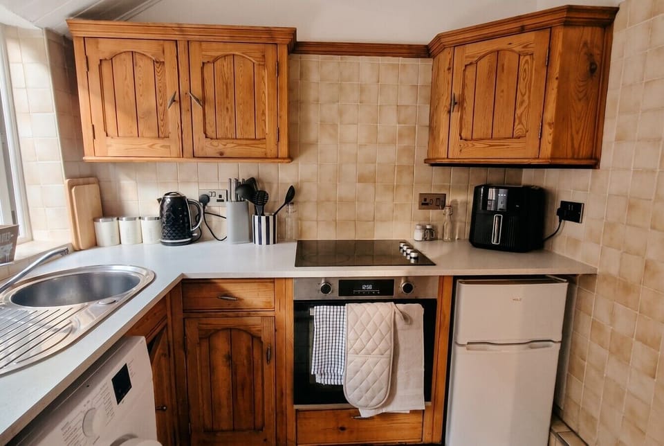 Compact country kitchen with everything you need including an air fryer
