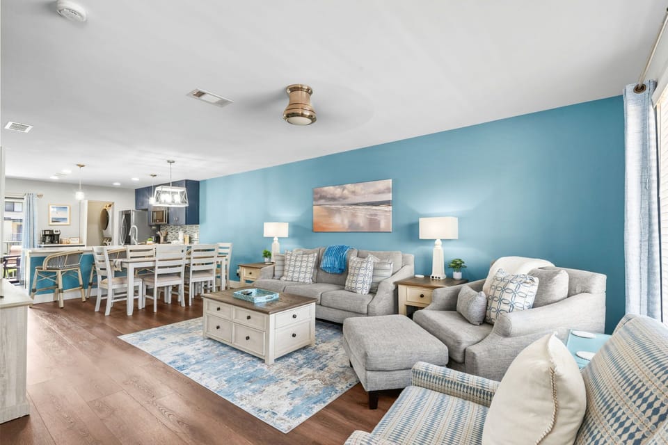 Sink into soft coastal comfort in your open-concept living and dining space and plenty of room to gather and unwind.