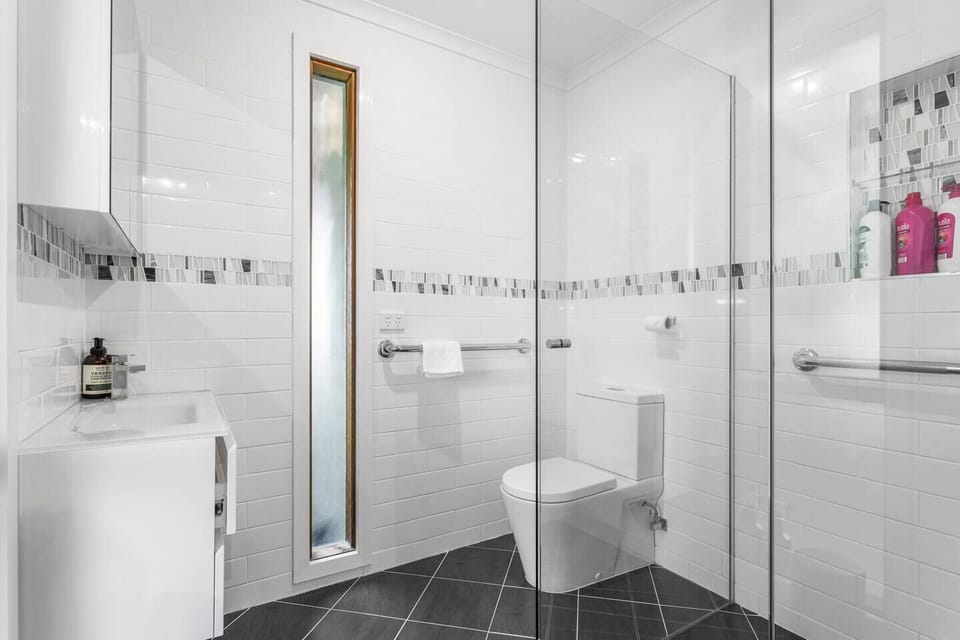 The ensuite delivers a clean, modern retreat with a walk-in shower that supports an easy start or restorative end to the day.