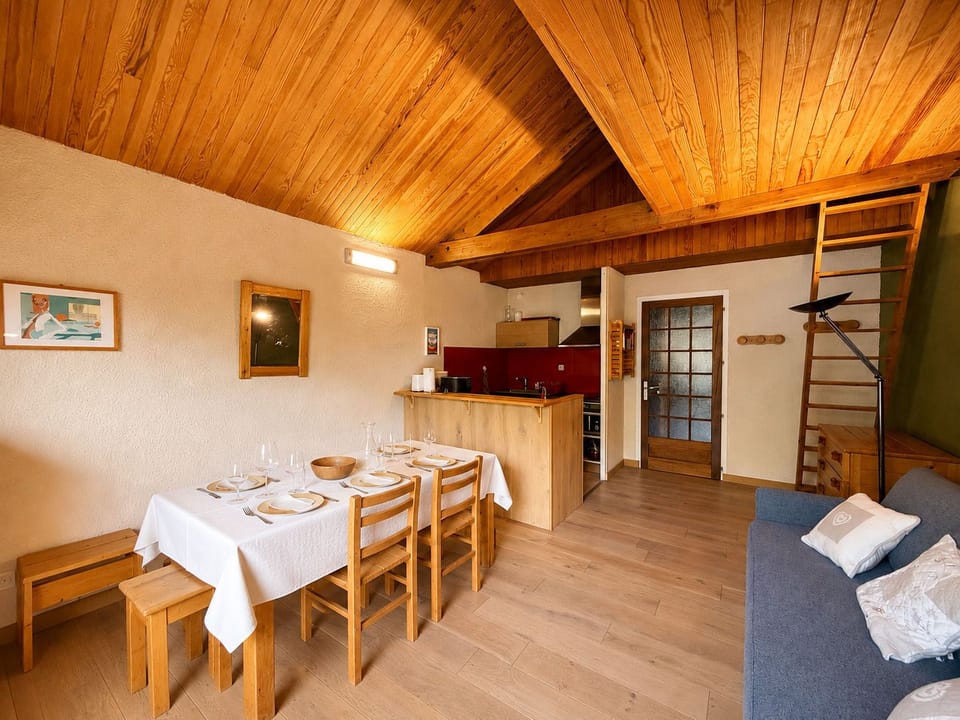 Cook up a meal in the open-plan kitchen and gather around the dining table to enjoy it.