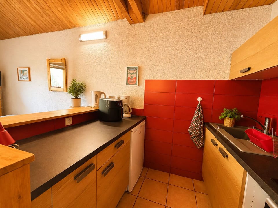 Whip up dinner using the stovetop, microwave, and air fryer tucked into the kitchenette.