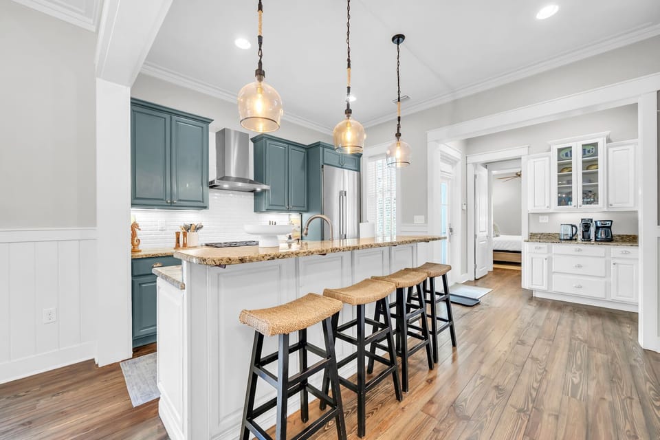 Fully stocked kitchen with island seating for four