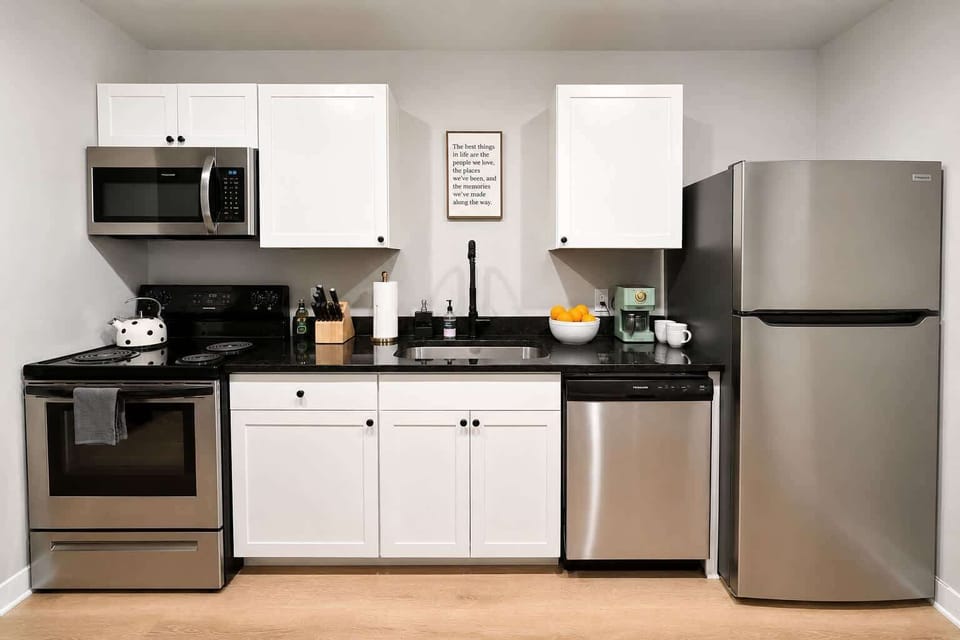 Unit A - kitchen with stove, dishwasher & fridge