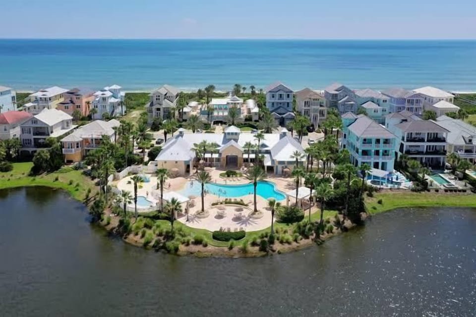 Aerial view of the Cinnamon Beach clubhouse pool, nestled between the lake and the Atlantic Ocean