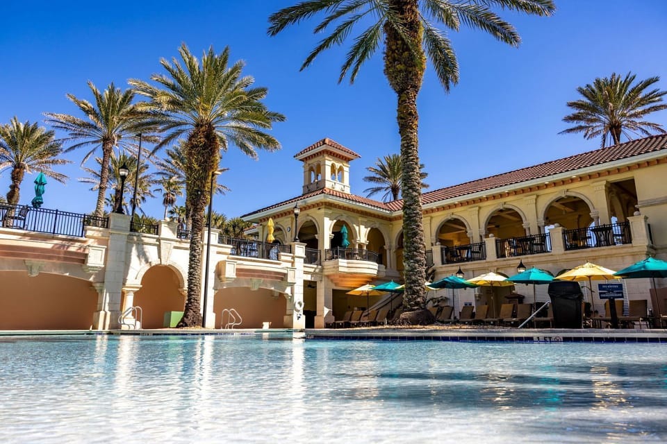 Enjoy the palm-tree lined pool. 
