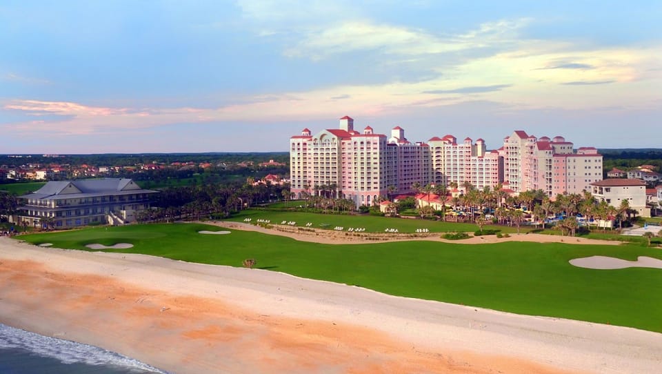 Resort complex and golf course stretching alongside the Atlantic at golden hour