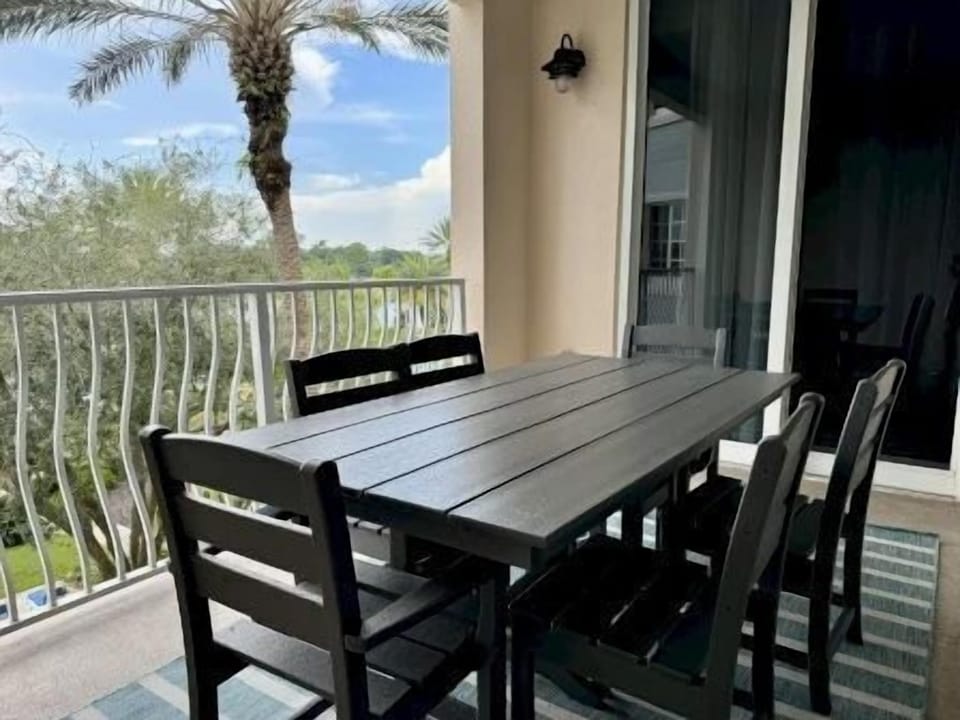Balcony dining table for two with open sunset views over the waterway