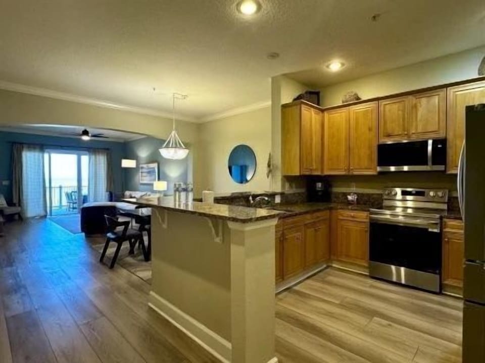 Open kitchen layout with bar counter — easy to cook and stay in the conversation at the same time