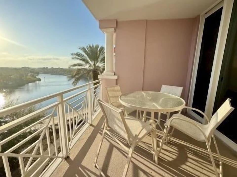 Private balcony with two chairs and waterway views — a front-row seat for the morning light