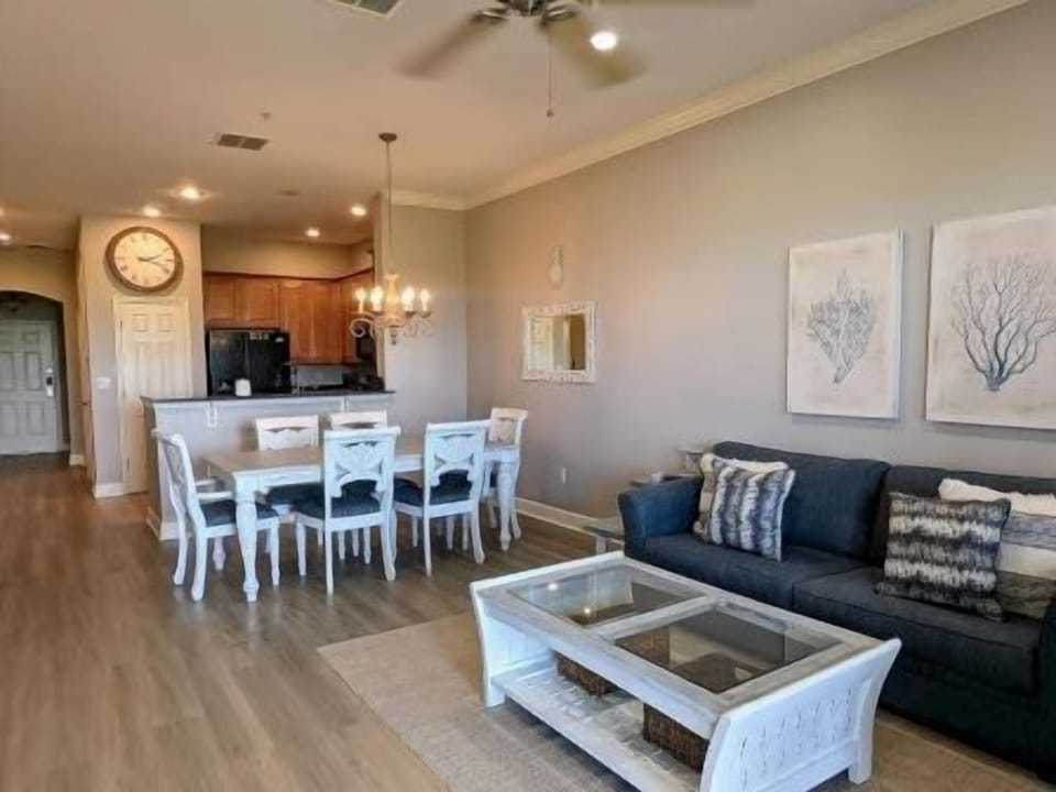 Farmhouse-style dining table with seating for six, open to the kitchen and living area