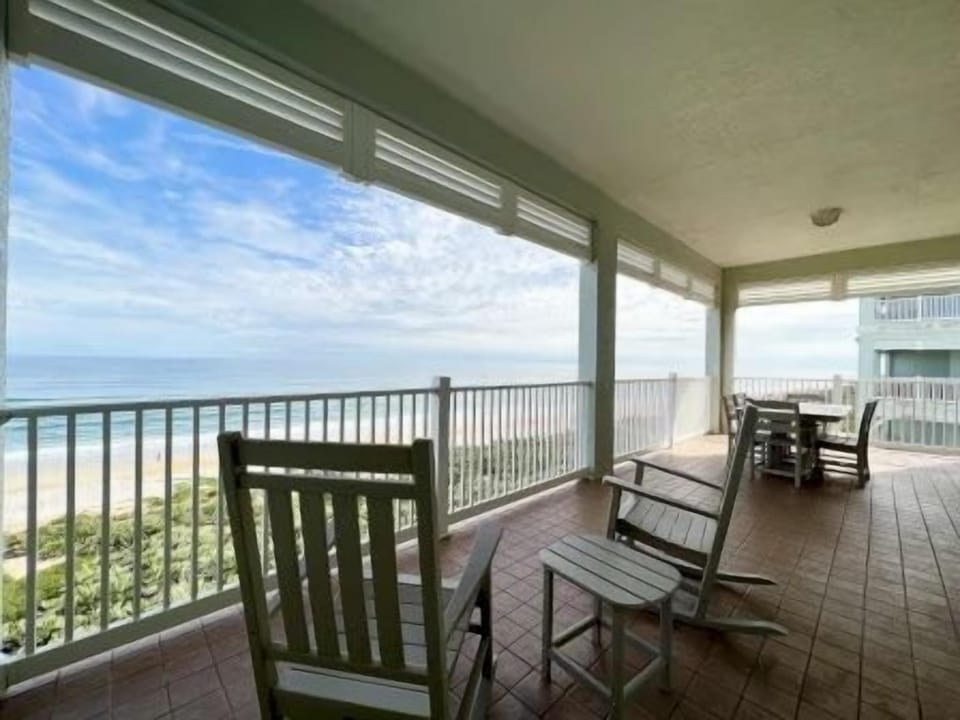 Private balcony with seating and open ocean views — morning waves and sea breeze included