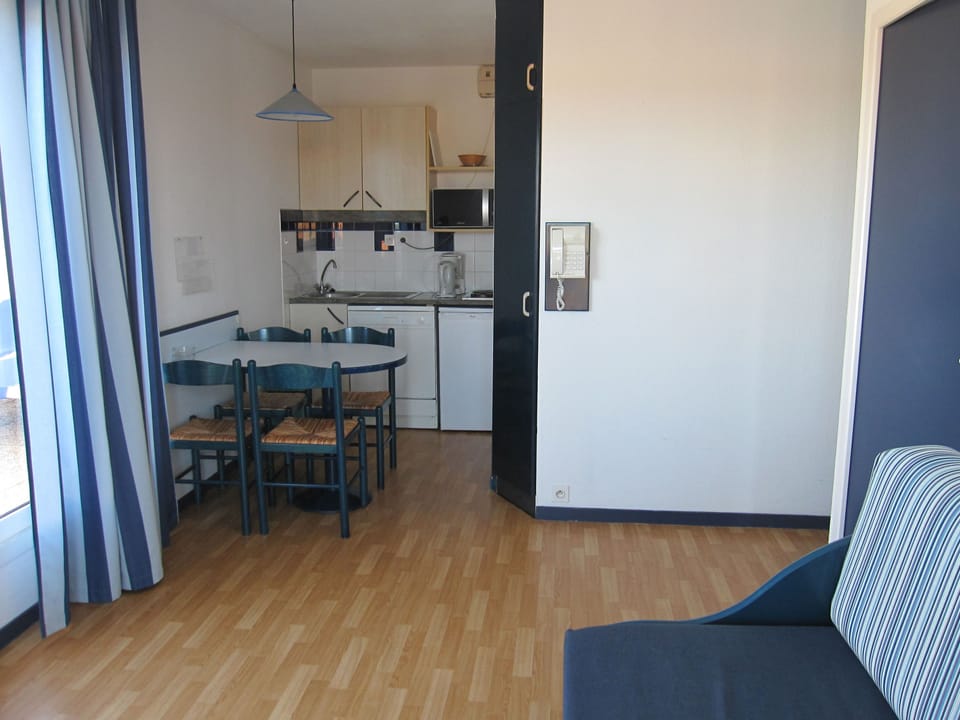 Cook up something simple in the kitchenette, then serve it up right at the dining table just steps away.