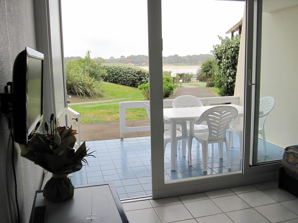 After a morning by the lake, these balcony doors open onto a quiet spot to unwind.