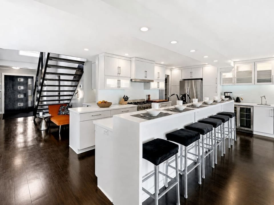 A long island with bar seating and abundant prep space makes the kitchen work well for large-group breakfasts and dinners.