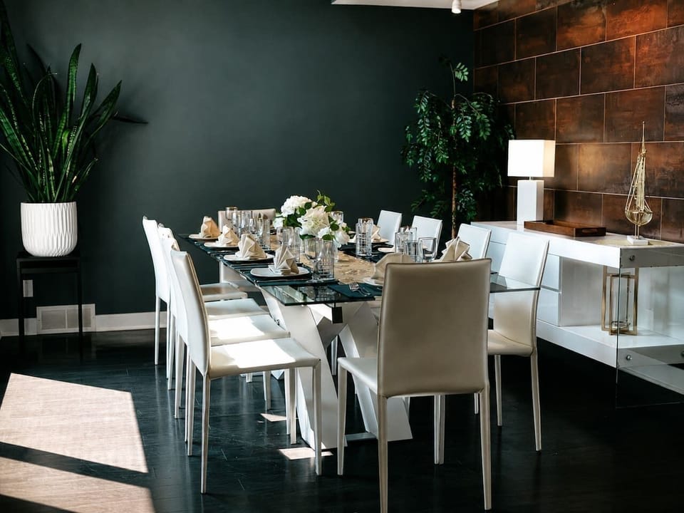 A closer look at the dining room’s layered textures, natural light and polished table setting.