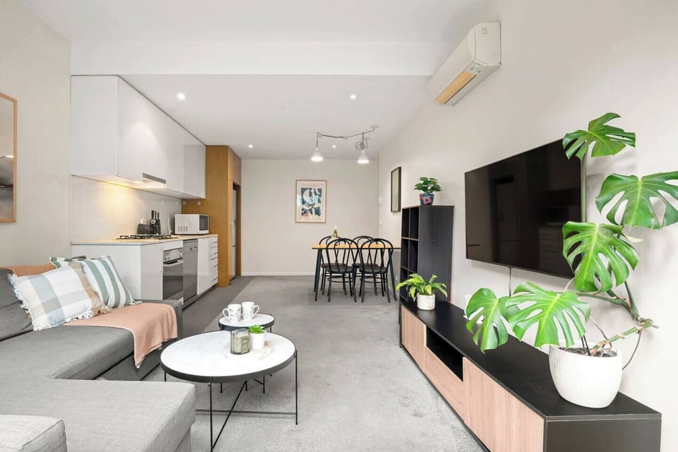 The open-plan layout links lounge, dining and kitchen zones to support relaxed gatherings.