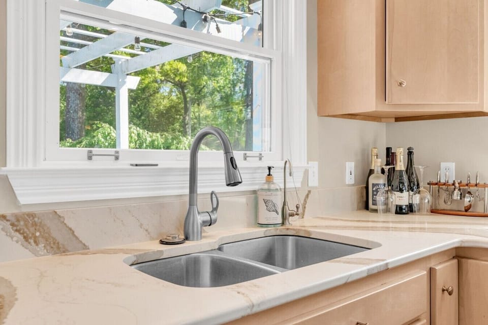 A sink with a view of the greenery