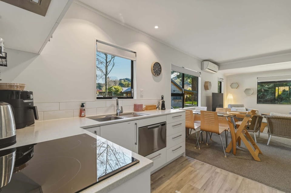 The cottage has a super functional kitchen with a dish drawer, an induction cooktop, an air fryer, and everything you need to whip up a lovely meal. 