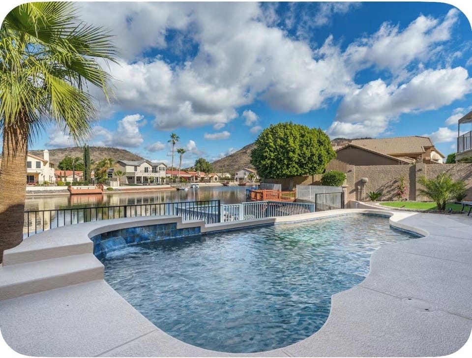 Waterfront backyard with heated pool and wide Glendale lake views