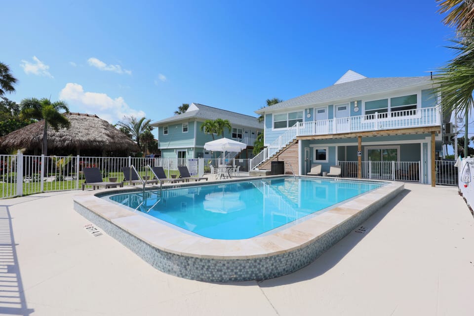 Outdoor pool, pool umbrellas, sun loungers