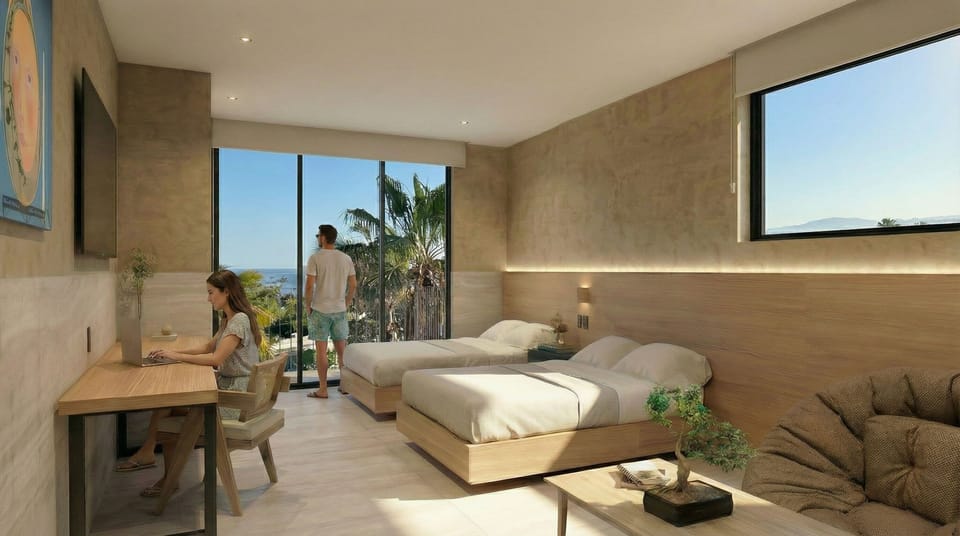 Deluxe Suite, Partial Sea View | In-room safe, desk, laptop workspace, blackout drapes
