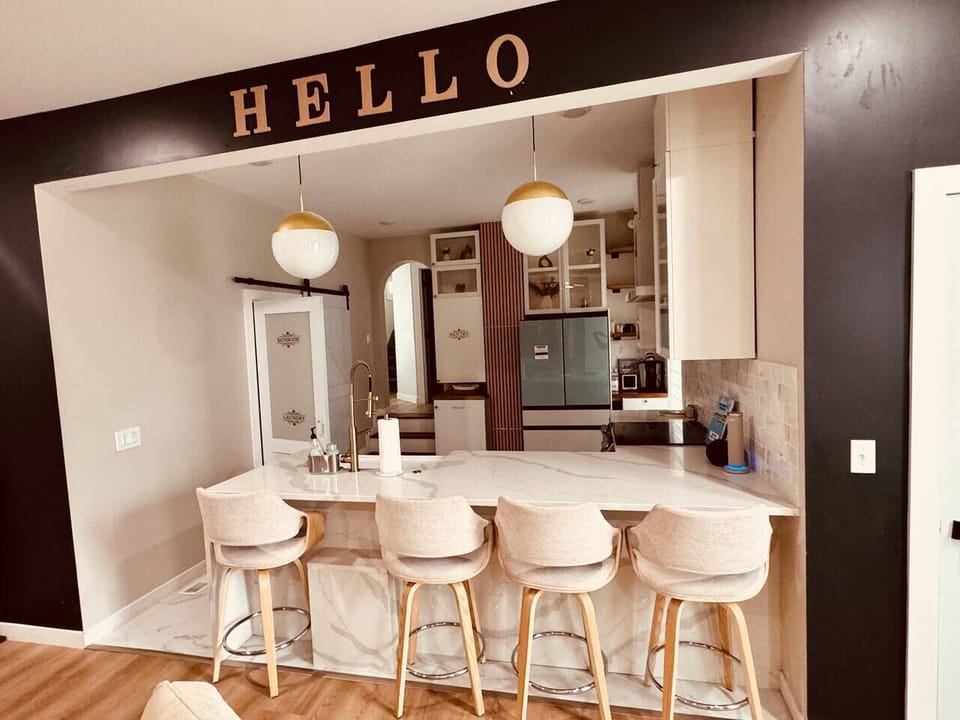 “Full Chef’s Kitchen • Quartz Waterfall Island • Bespoke Appliances”