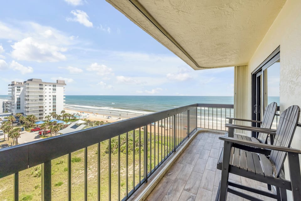 Enjoy the Florida sunshine from The Ormondy Unit B7's private balcony, featuring stunning ocean views and a relaxing coastal breeze