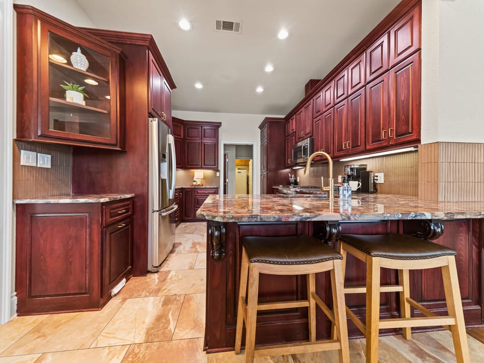With plenty of counter space and seating nearby, the kitchen is ready for everything from quick breakfasts to family dinners.