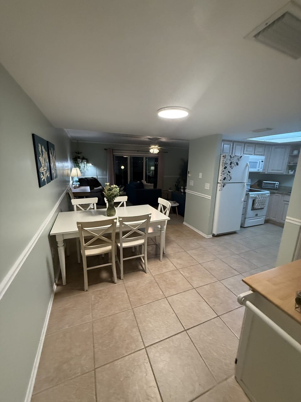 Bright open dining area with full kitchen and easy flow to living space
