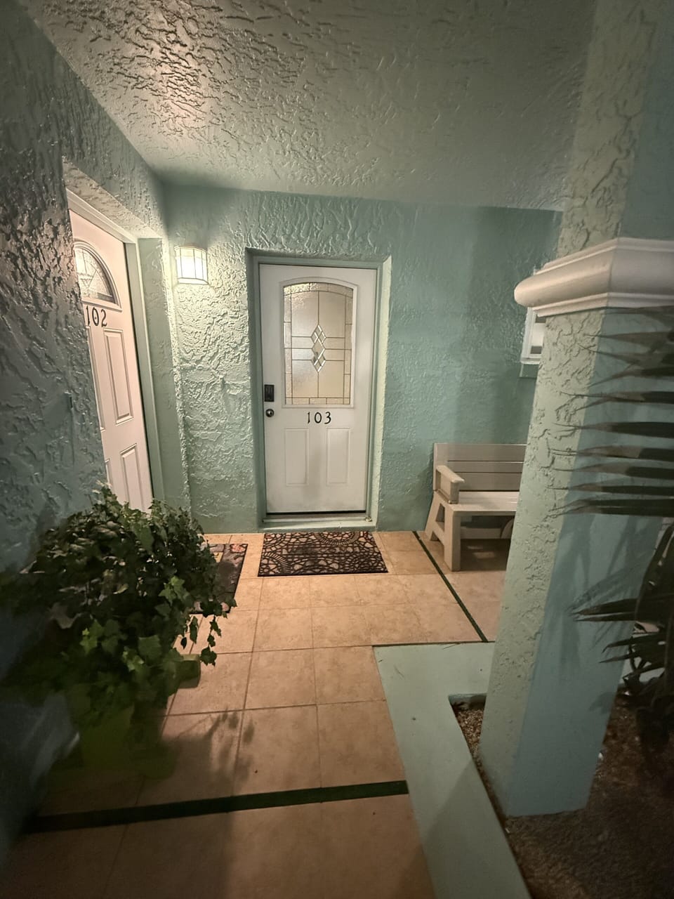 Charming private entry with covered walkway and inviting curb appeal