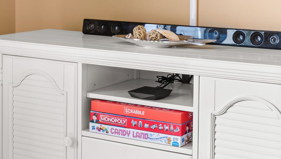 Lots of Board Games in the Media Cabinet