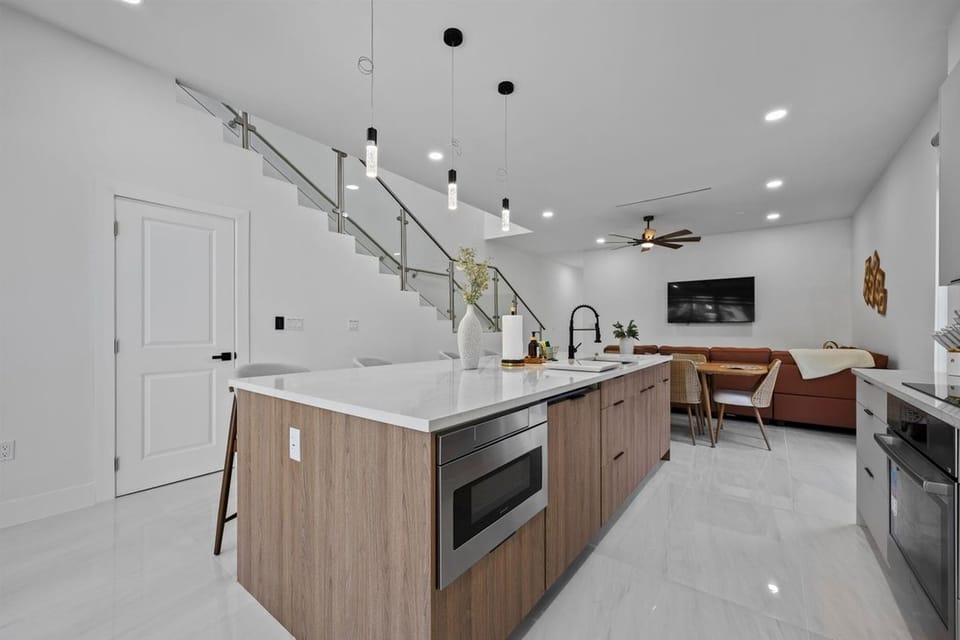 Open-plan living and dining room with abundant natural light.