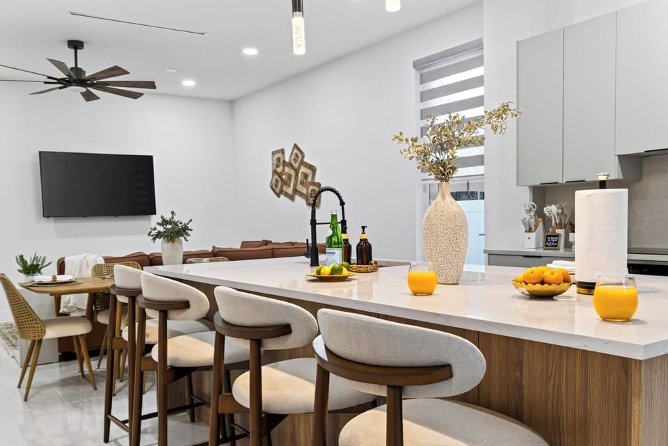 Pull up a seat at the kitchen island for casual breakfasts, drinks, and conversation.