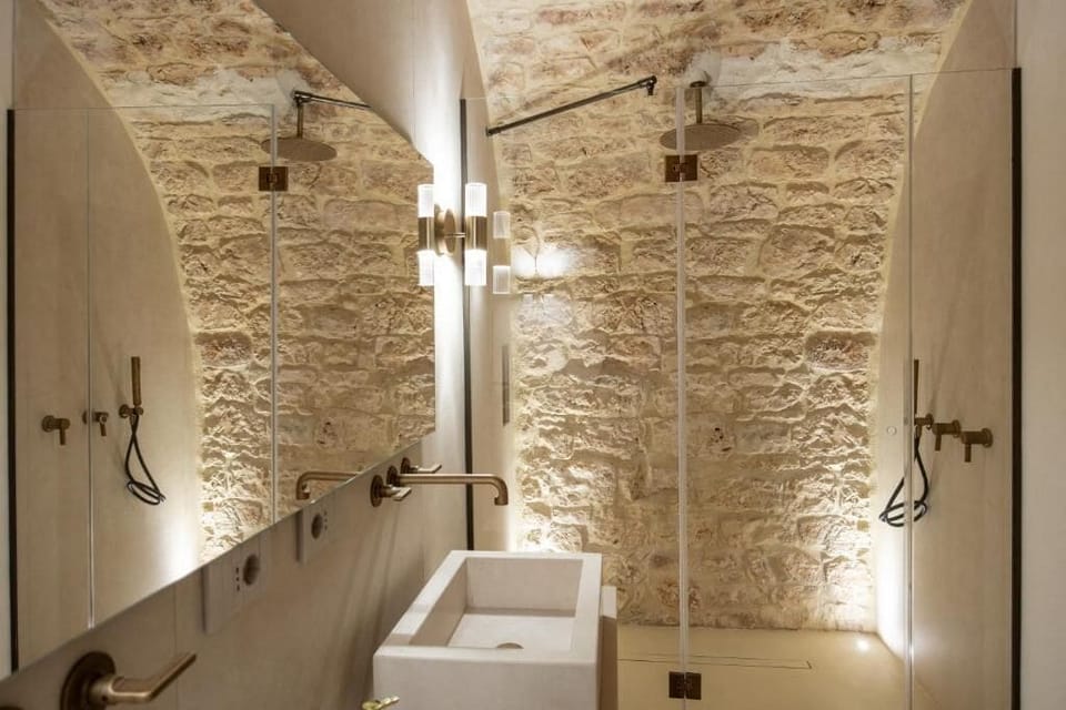 Suite, Patio, Garden View | Bathroom | Separate tub and shower, hair dryer, slippers, towels