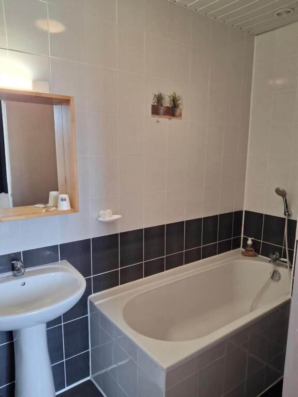 Bathtub, hair dryer, towels, soap