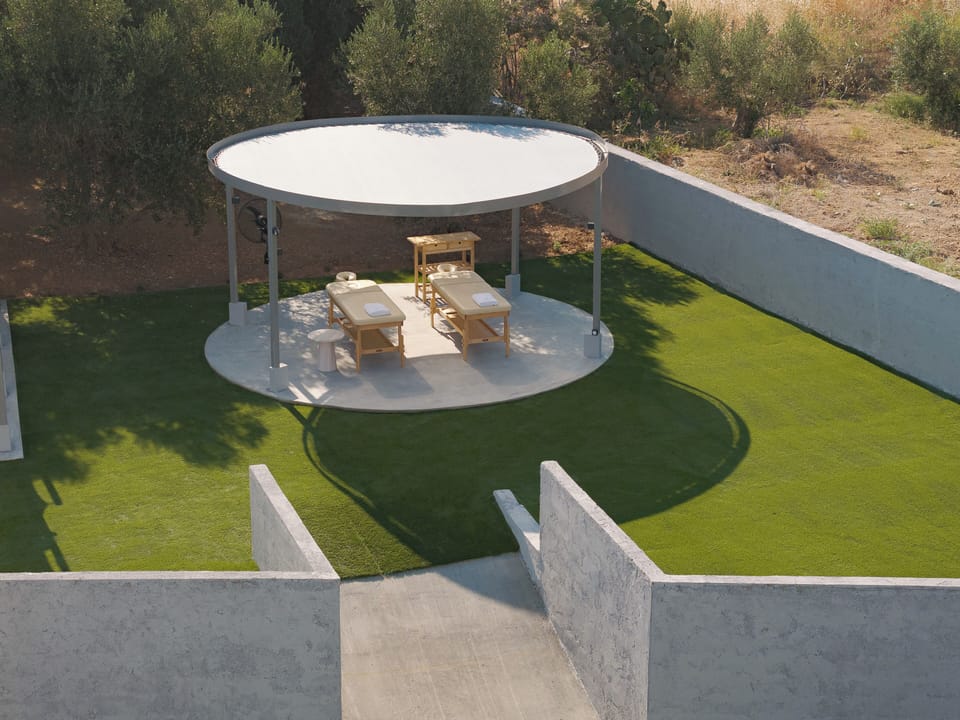 Two massage beds create a peaceful setting for outdoor wellbeing.