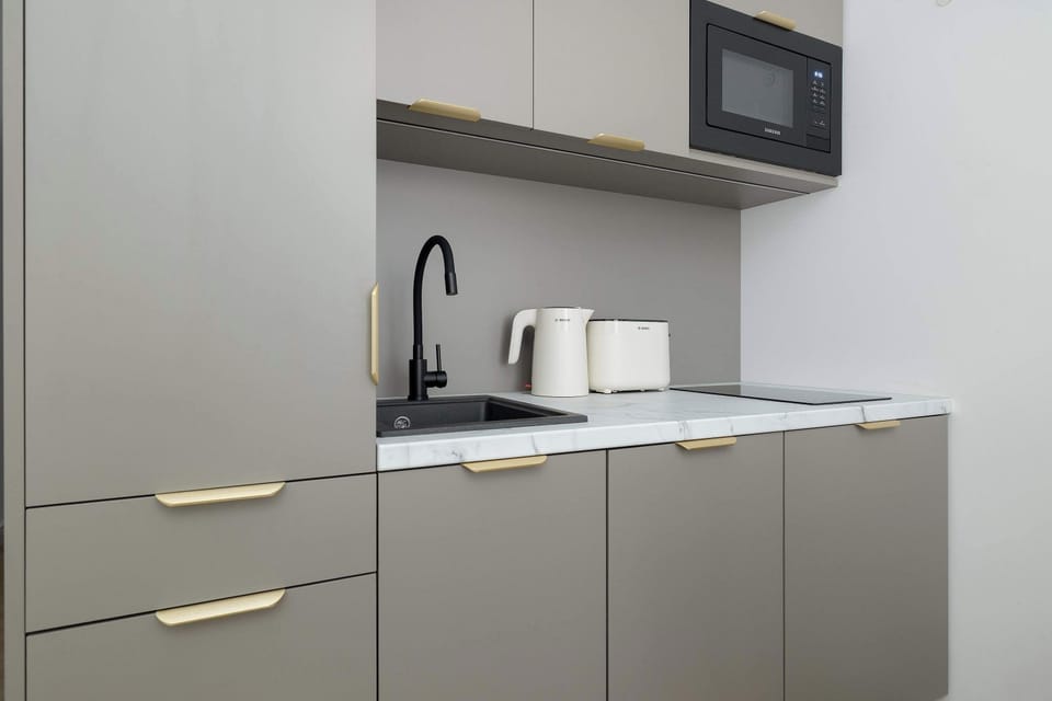 A fully equipped kitchenette with modern appliances and plenty of storage space. Everything you need for convenient everyday cooking is within easy reach.