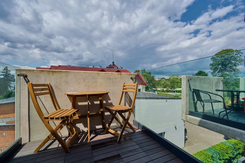 The balcony visible from the interior, emphasizing natural light entering the living space.
